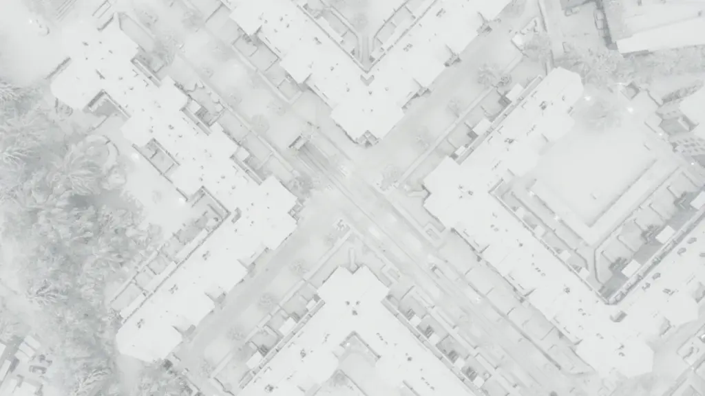 Vue aérienne urbaine d'un quartier dense et moderne avec des immeubles résidentiels.